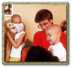 Children who are suffering from cancer interacting with a care giver.