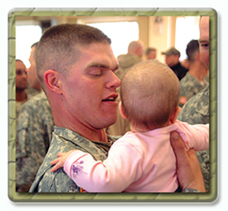 Soldier holding his child.