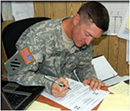 Soldier filling out paperwork
